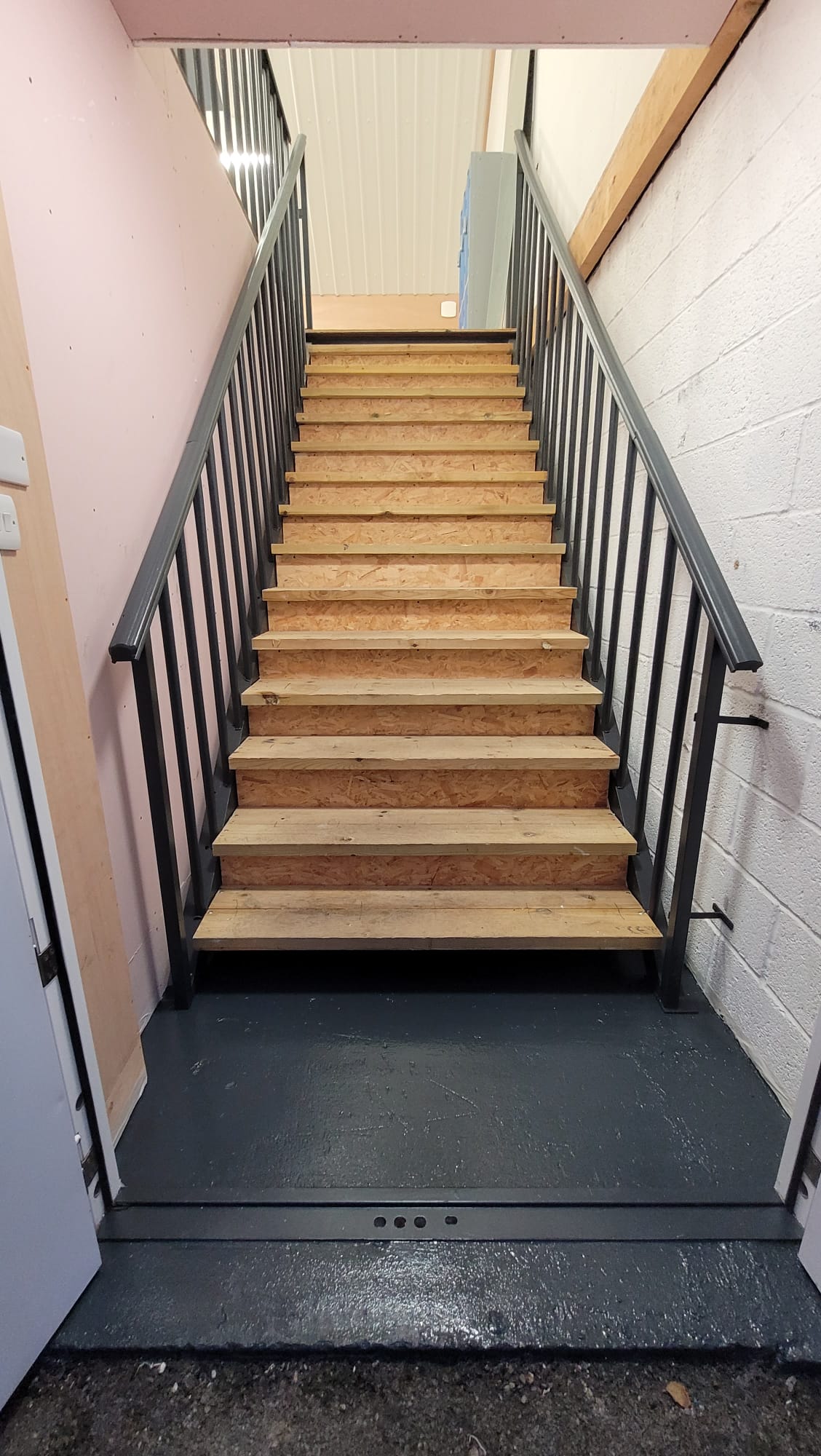 New handrails and treads fitted to unit staircase