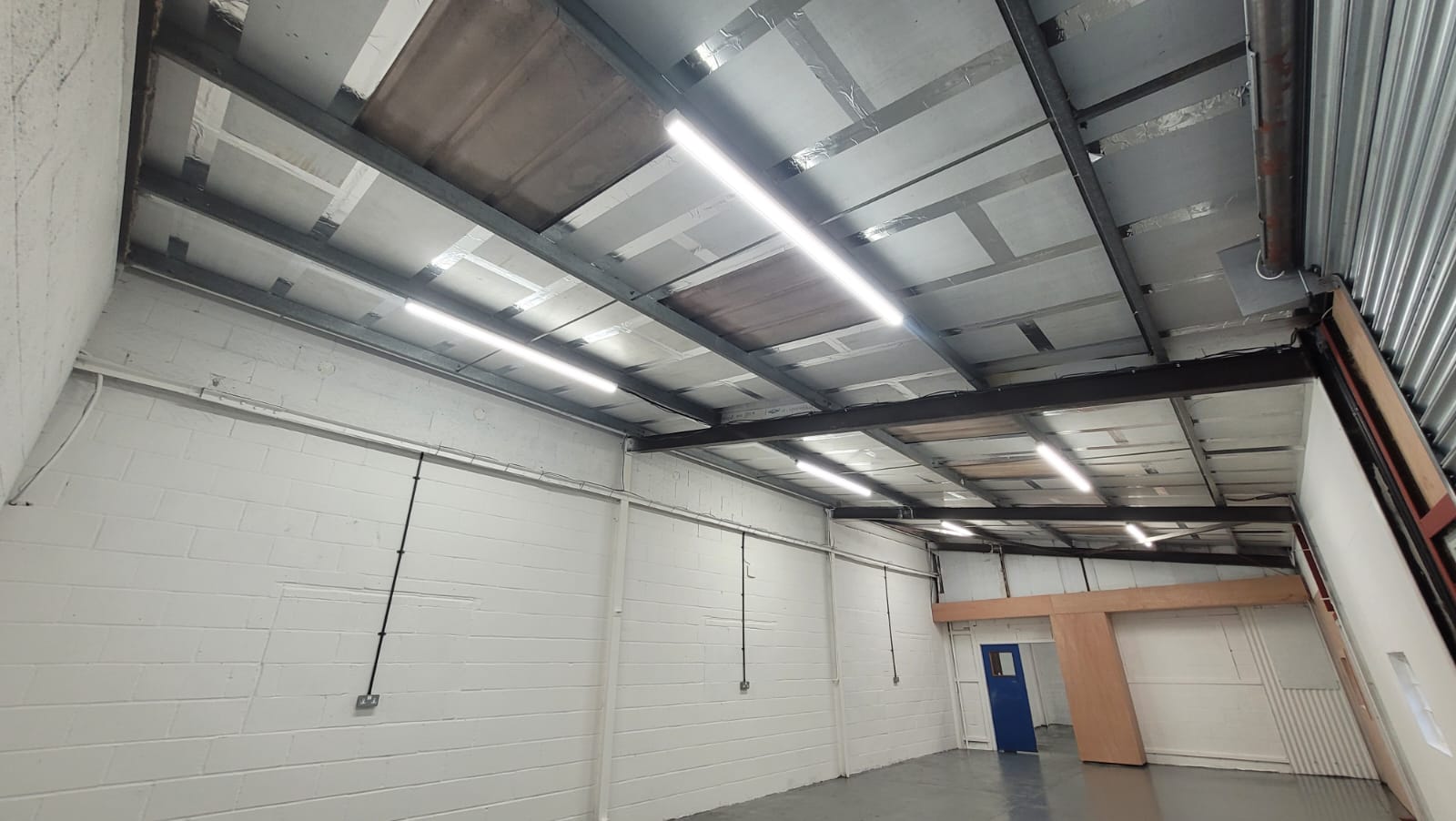 New LED strip lighting and sealed insulated ceiling in industrial unit