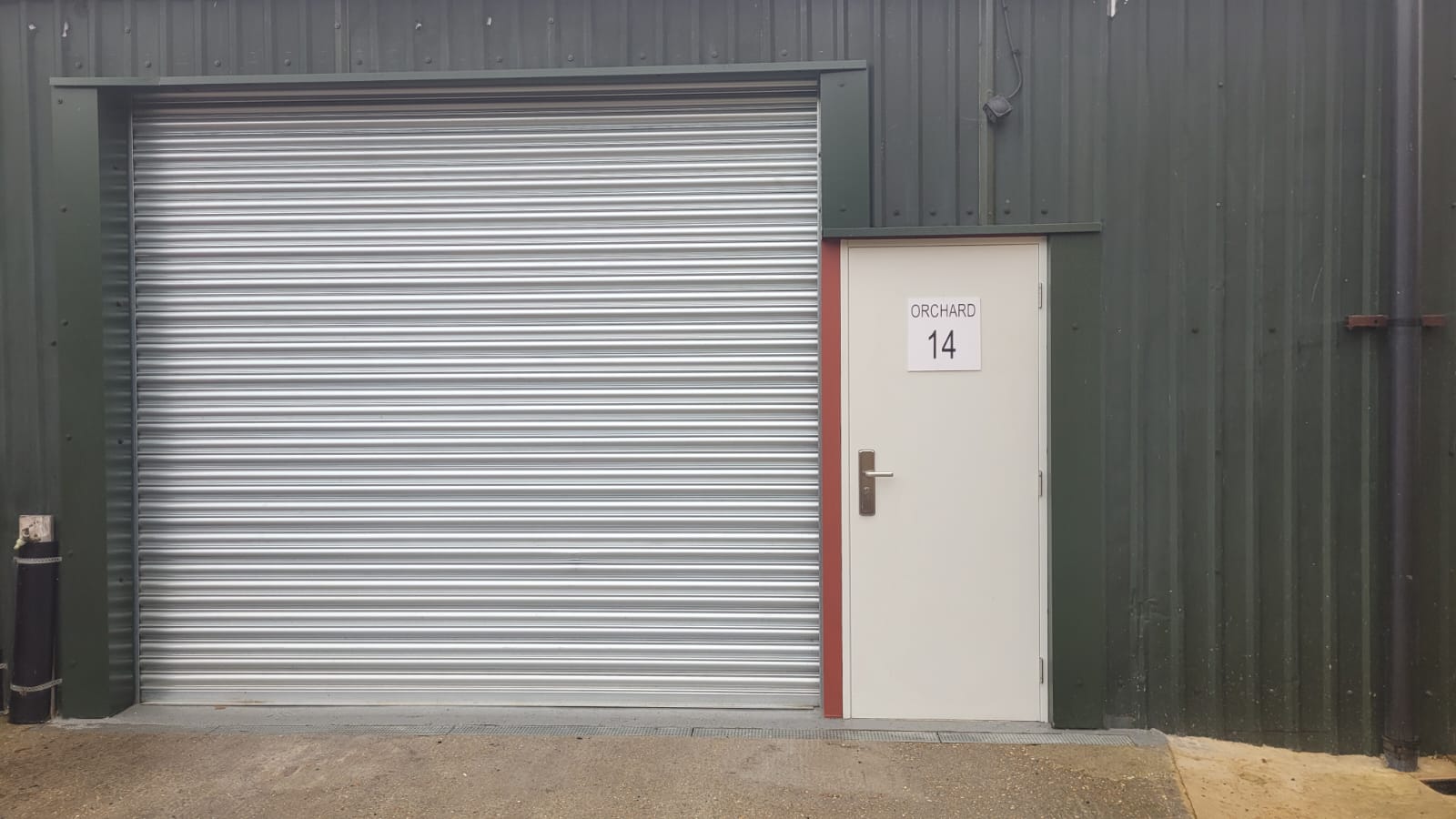 New roller shutter door and personnel door on industrial unit