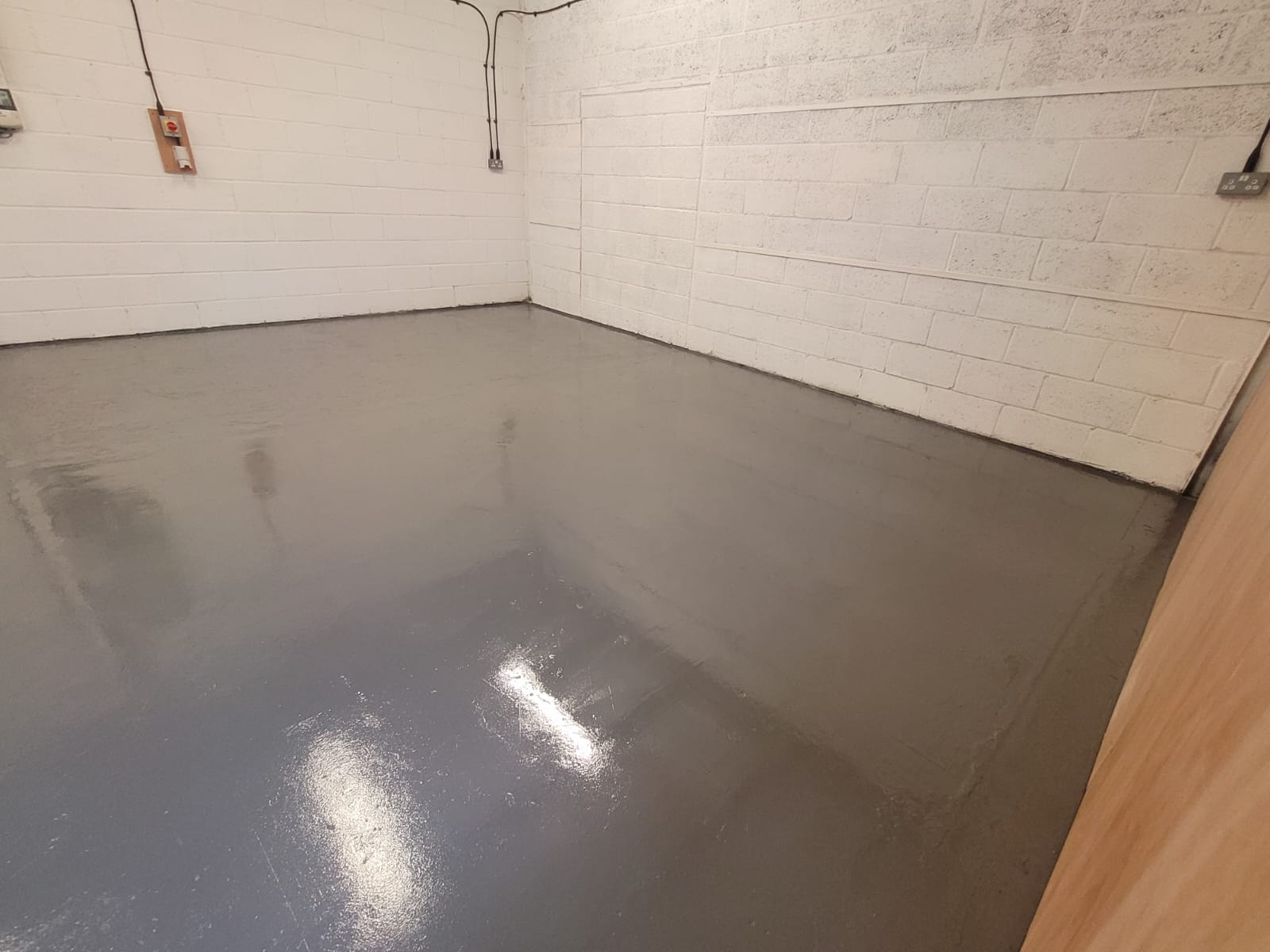 Workshop floor degreased and painted with polyurethane floor paint