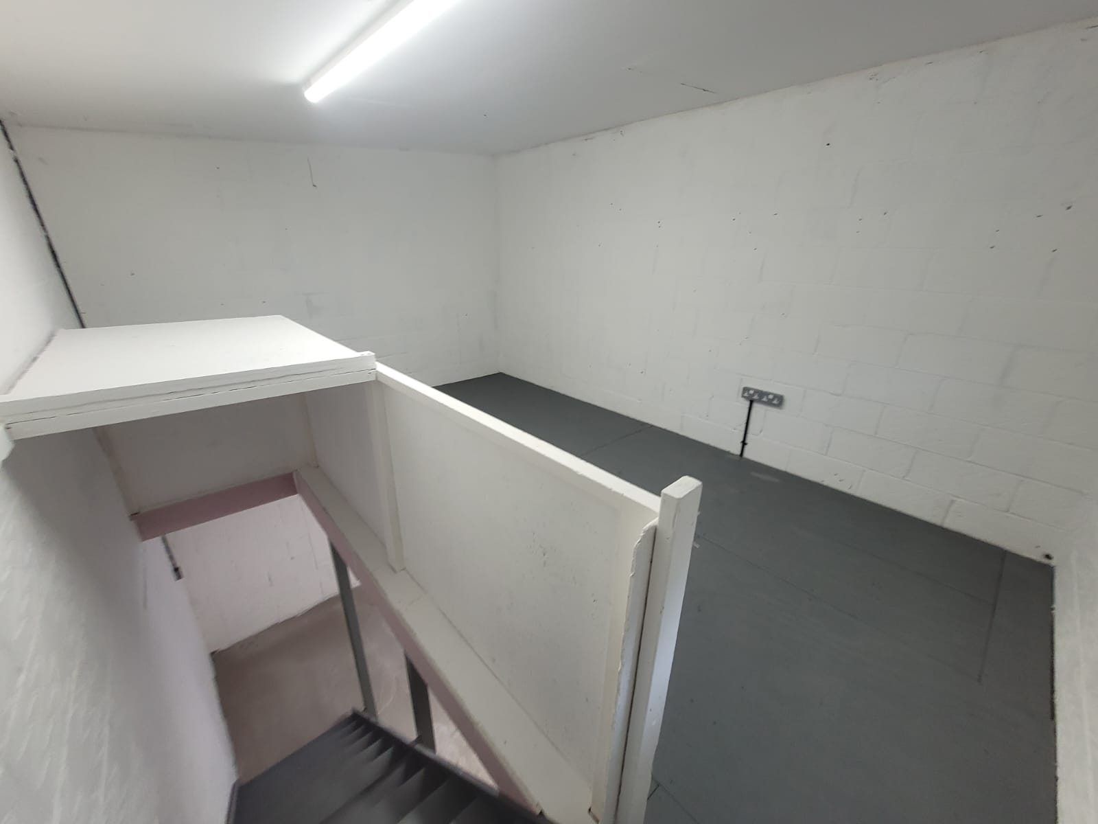 Unit after conversion — painted, boarded, new sockets