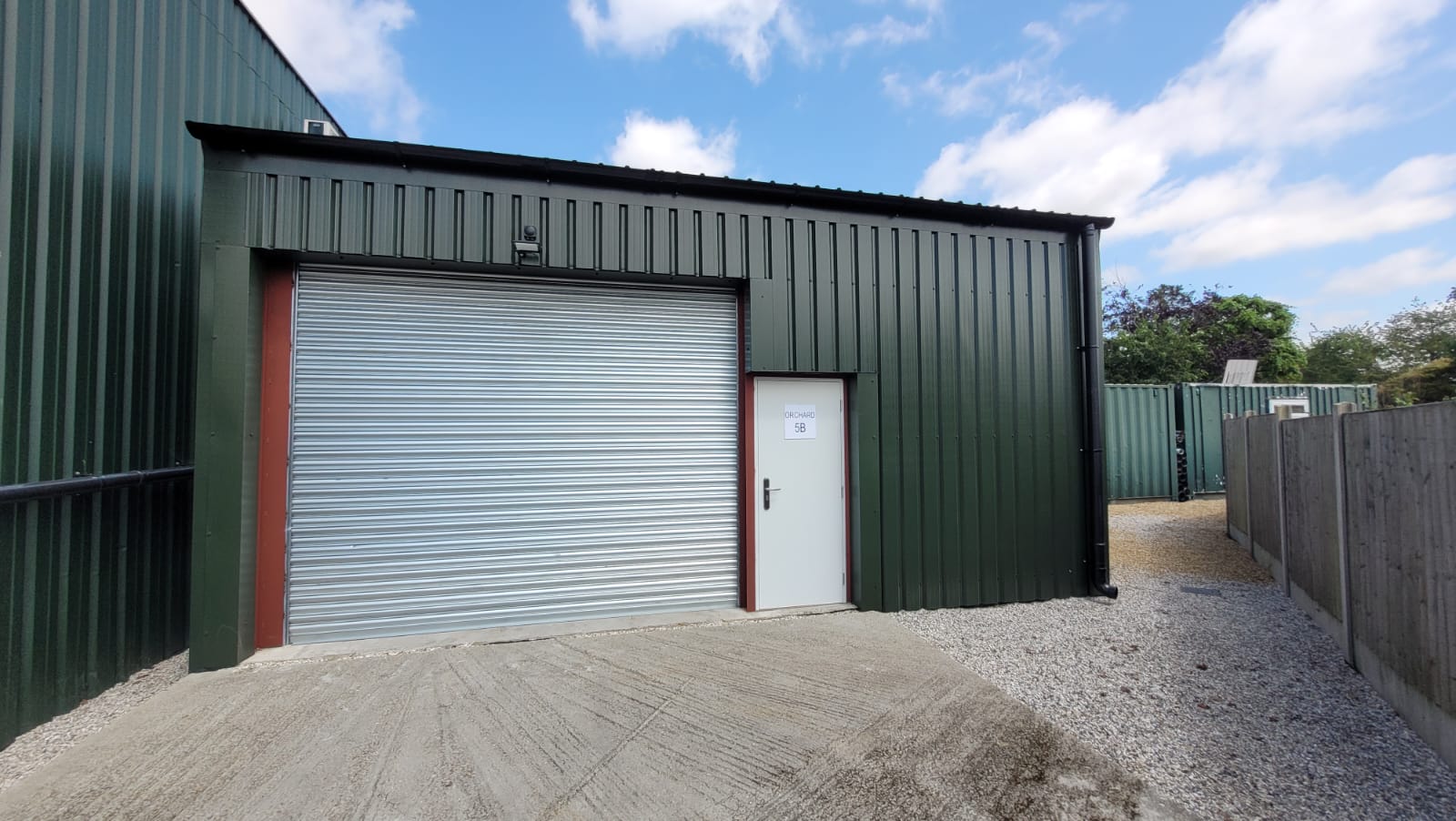 Newly built steel-clad industrial unit with roller door