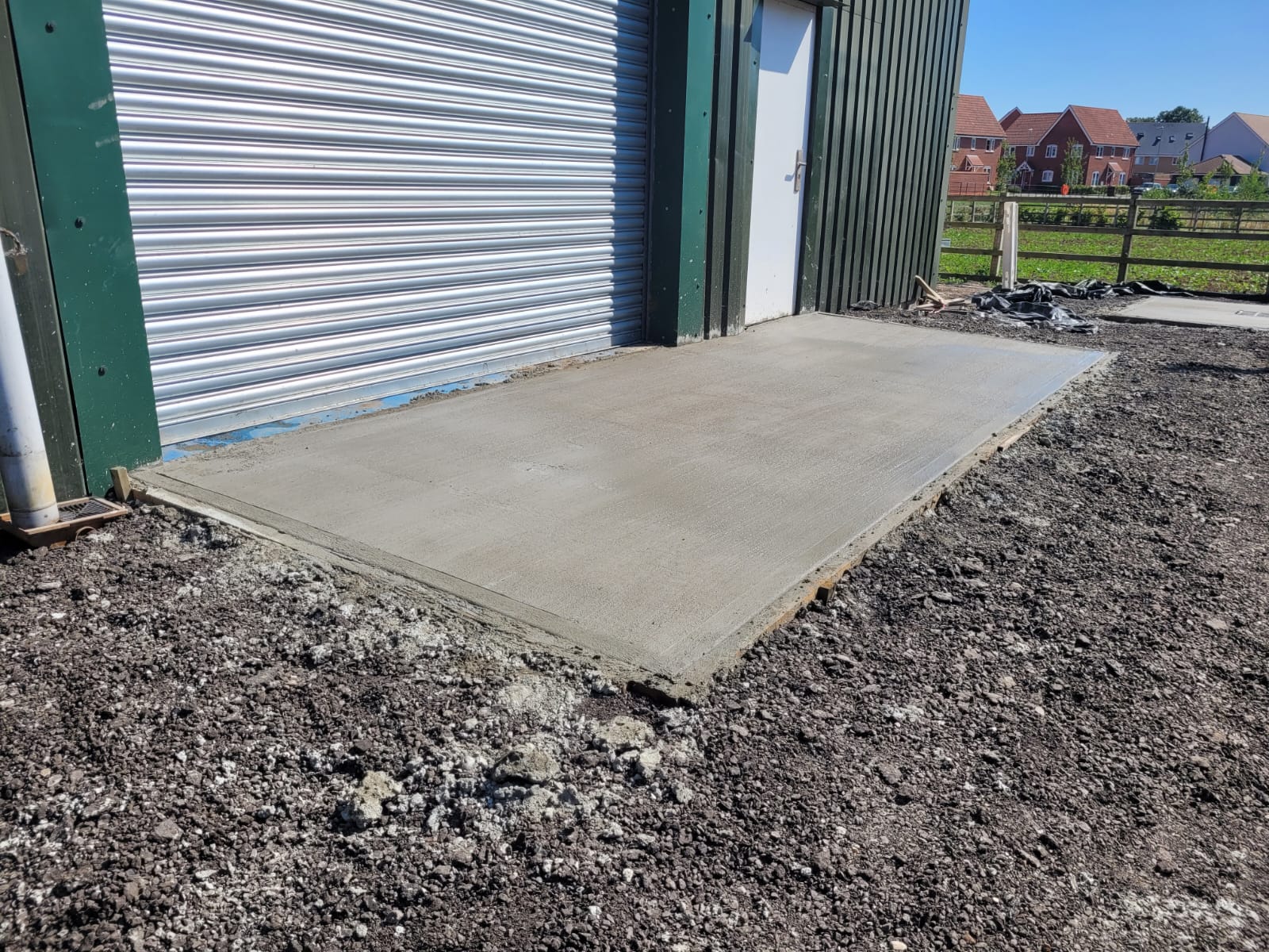 Fresh concrete slab poured outside industrial unit
