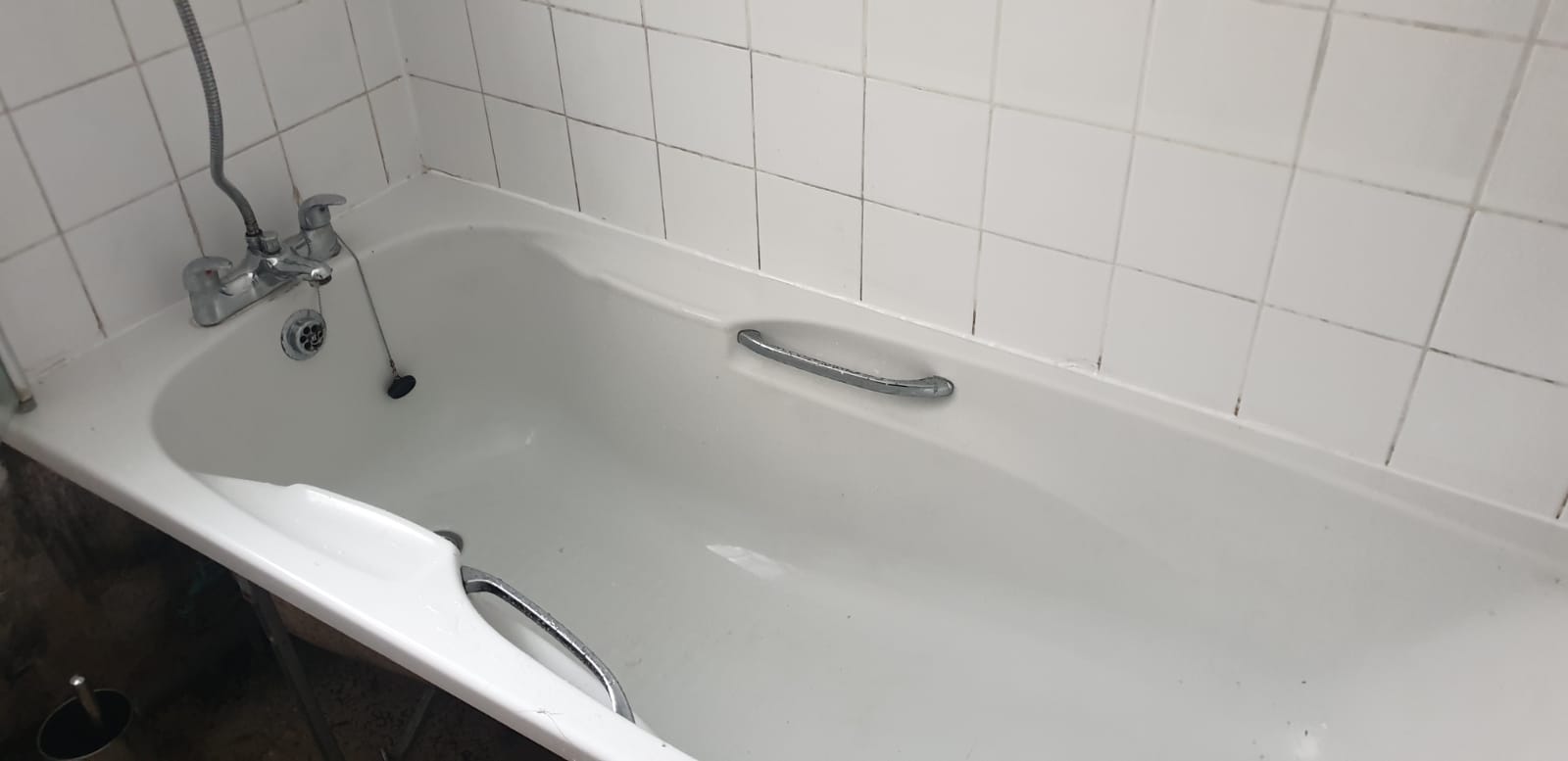 Bath resealed and surround cleaned