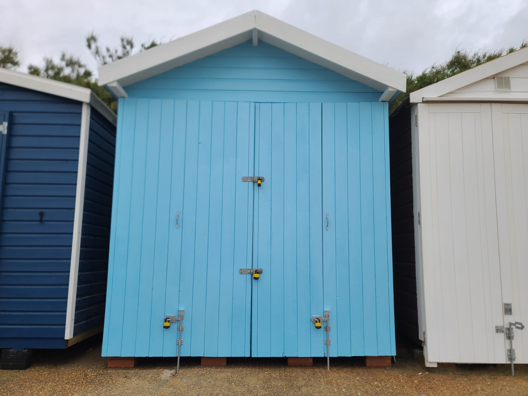 Beach hut rebuilt and repainted in light blue